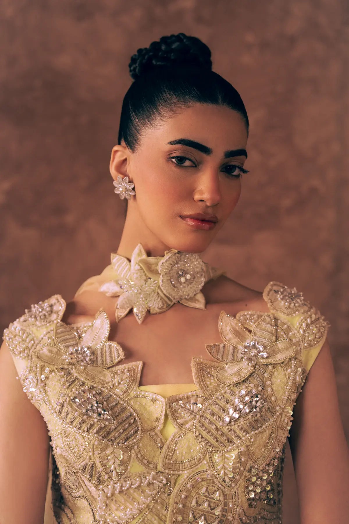 Close-up of Blooming Dawn Pakistani formal wear neckline with 3D floral choker, pearls, sequins and zardozi embroidery