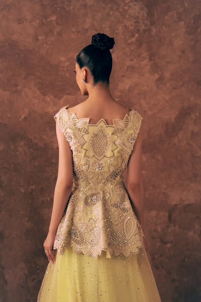 Back view of Blooming Dawn peplum blouse with floral zardozi, pearl and sequin embroidery and scalloped hem