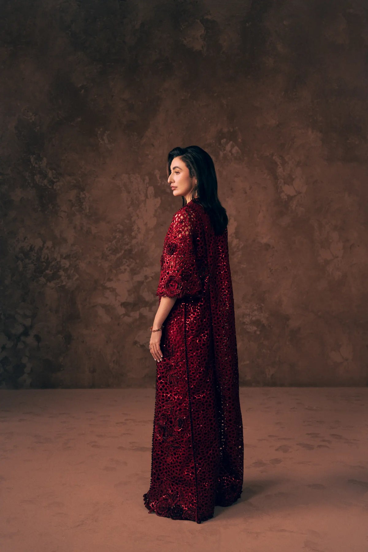 Side view of Crimson long cutwork jacket with sequins, 3D rose embroidery and three-quarter sleeves