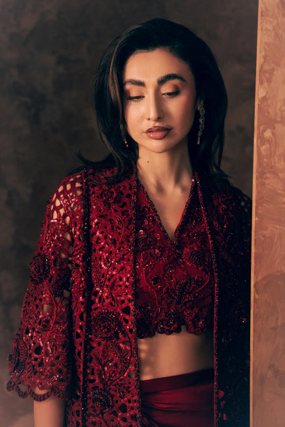 Close-up of Crimson luxury Pakistani clothing with sequin cutwork jacket, rose embroidery, beads and scalloped sleeve hem
