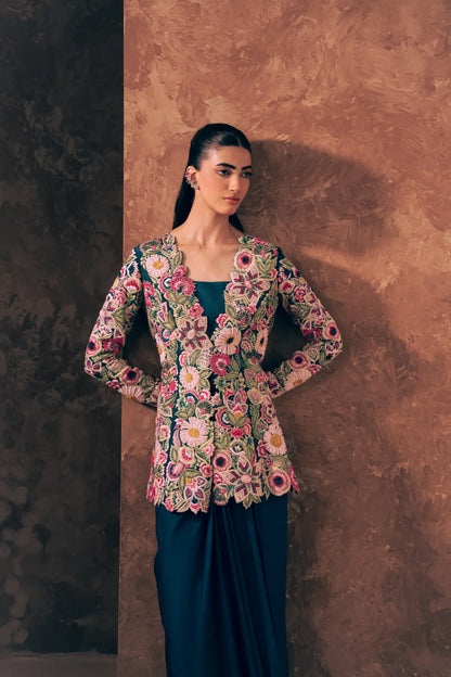 Woman wearing Vestis Pret Floral Fiesta 3 piece formal dress with embroidered peplum, blouse and satin silk skirt, front view