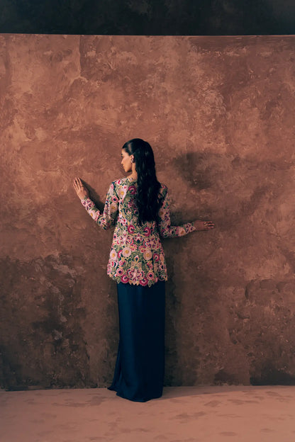 Back view of Vestis Pret Floral Fiesta 3 piece Pakistani formal dress showing full floral embroidery on peplum and satin silk skirt