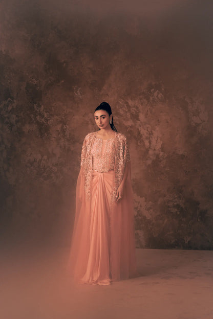 Full-length view of Vestis Pret Florence 3 piece formal dress with embroidered net cape, blouse and pleated pant in blush pink