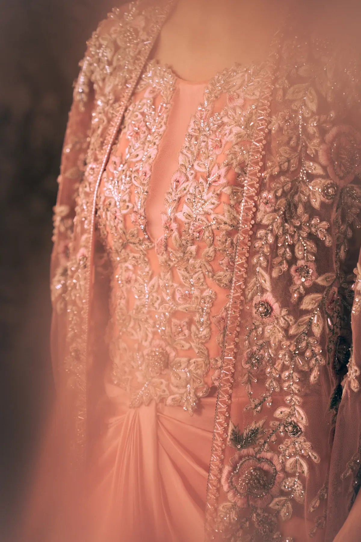 Close-up of pearl, sequin and thread floral embroidery on Florence blush pink net cape and blouse with draped satin silk pant