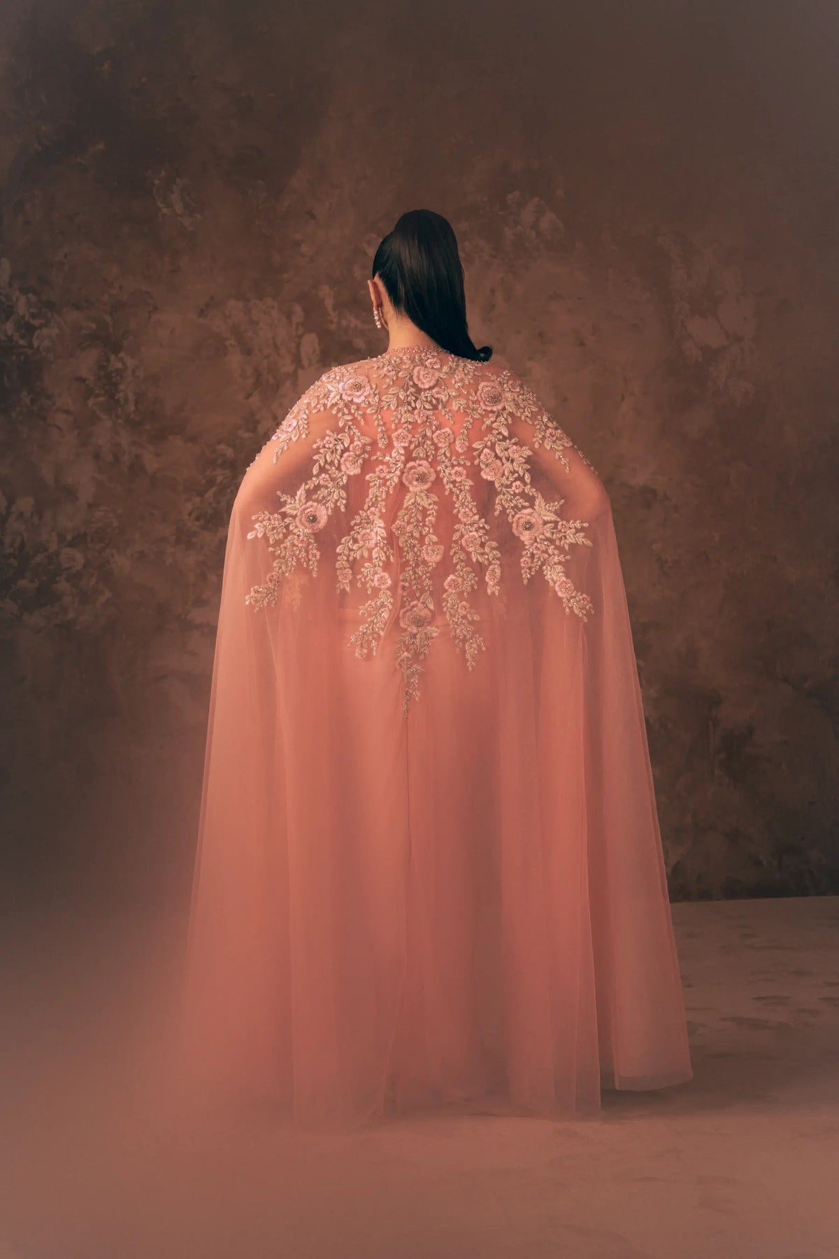 Back view of Vestis Pret Florence 3 piece Pakistani formal dress showing floral embroidered net cape with long sheer flow
