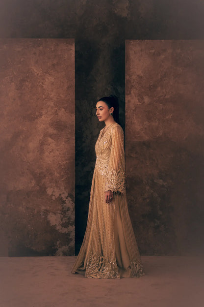 Side profile of Ivory Opulence Pakistani formal dress with striped beaded net jacket and embroidered hem