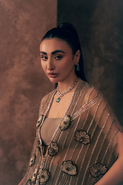 Close-up of sheer net cape with beaded stripes and 3D sequin flower embroidery on Lunar Grace Pakistani formal dress