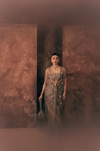 Lunar Grace Pakistani party wear dress with embroidered net cape and trouser, styled with a fringed potli bag