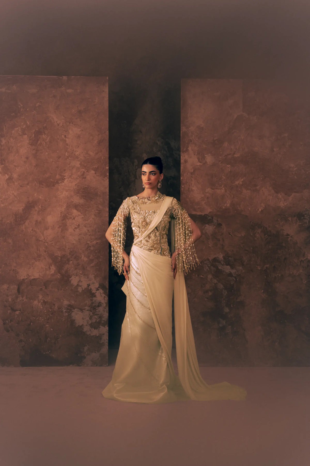 Full-length view of Vestis Pret Pearl Drapes 1 piece formal dress with pearl tassel sleeves, embroidered bodice and draped satin silk train
