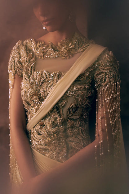 Close-up of pearl, sequin and gold thread floral embroidery on Pearl Drapes luxury Pakistani formal wear net bodice with draped sash
