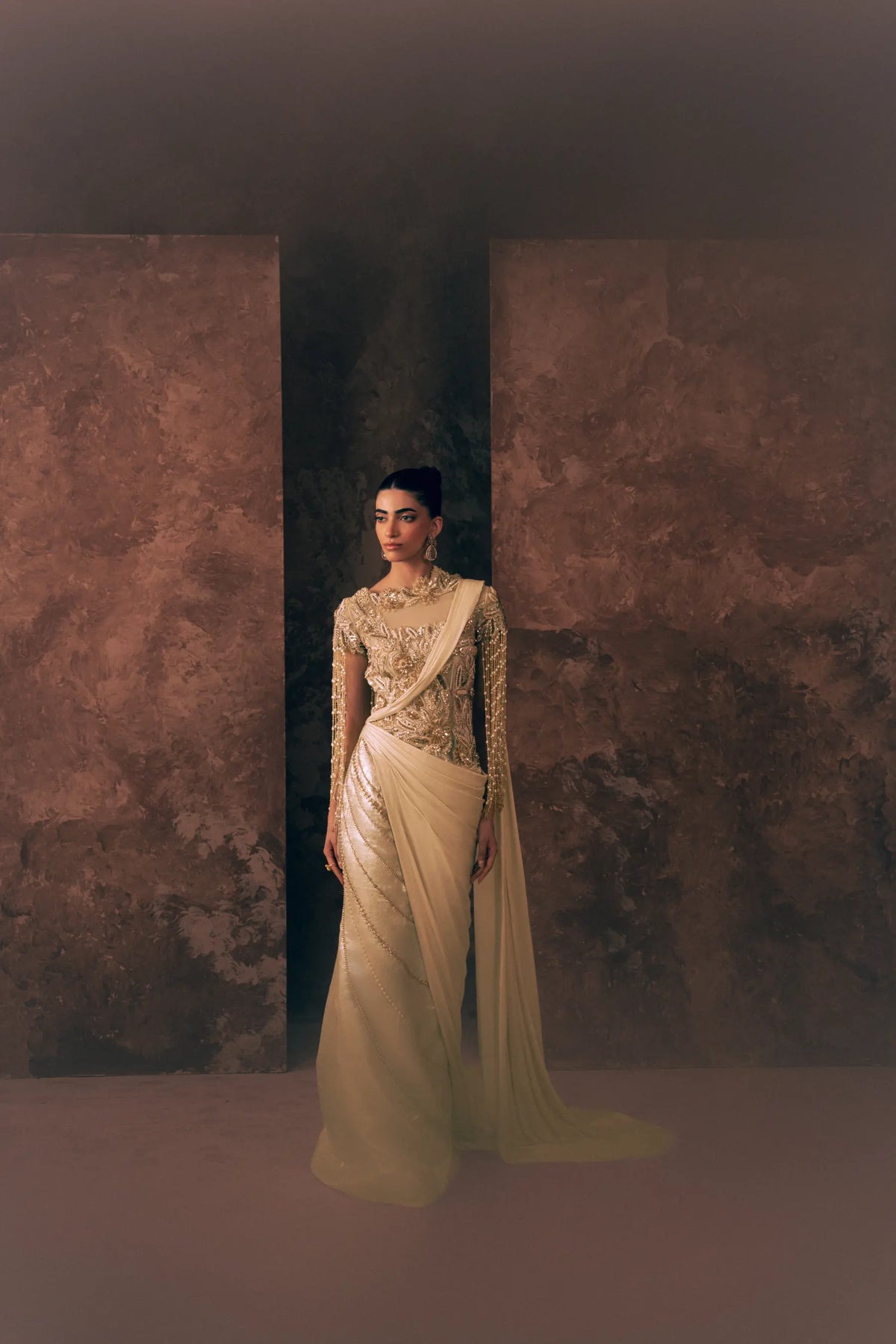 Pearl Drapes Pakistani formal dress with hand-embroidered net bodice, pearl fringe sleeves and draped satin silk skirt